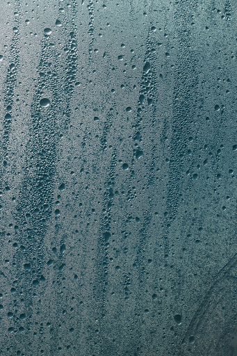 Steam shower with condensation on glass